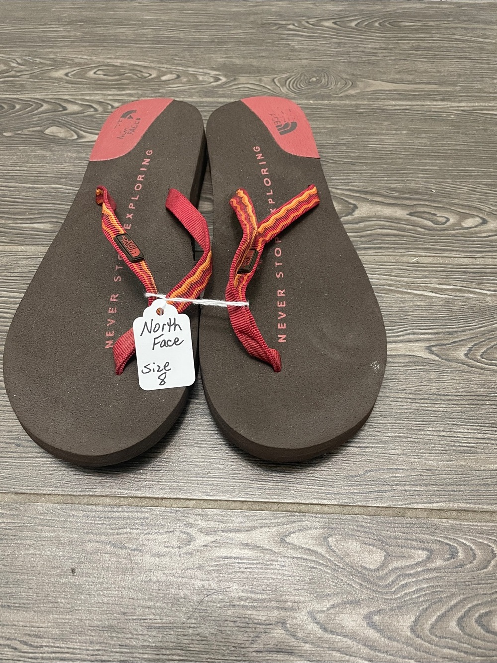 The North Face Brown Footbed Flip Flops with Red & Orange Straps